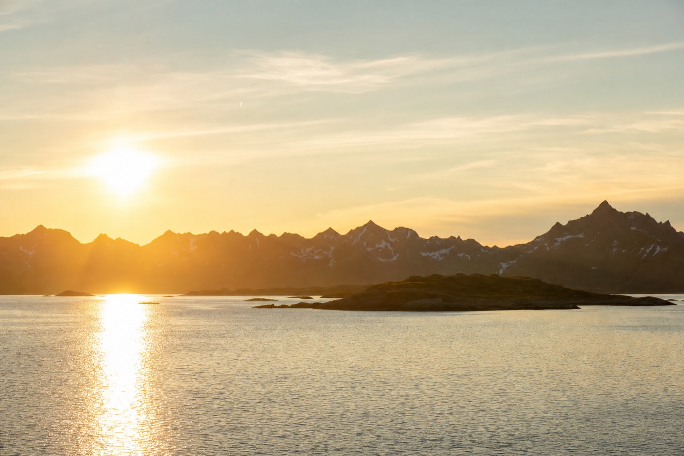 The midnight sun over a Lofoten fjord