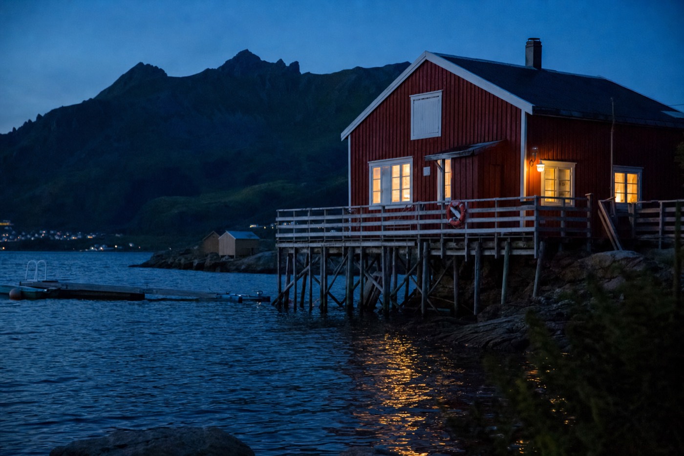 Reine's red fishermen's cabins over the water